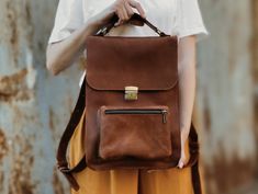 "Check out our OTHER PRODUCTS https://www.etsy.com/shop/BartBag Model Angry: Compact, stylish backpack made of genuine leather with vintage style scuffs. It will match any style and occasion - it looks great both with оjeans and sneakers or dress. It is compact and roomy at the same time. * Backpack size: 10 x 14 x 4.4 '' / 25 x 35 x 11 cm. * Outer zippered pocket: 8.7\" / 22 cm х 6.7\" / 17 cm. * Inside pocket on the back side: 7.9\" / 20 см х 5.9\" / 15 cm. * Adjustable straps: 0.8 '' / 2.7 cm Backpack Model Photoshoot, Daily Use Standard Backpack In Cognac, Cognac Leather Standard Backpack, Everyday Cognac Backpack, Plastic Handbag, Leather Backpack Women, Women Sling Bag, Laptop Backpack Women, Leather Laptop Backpack