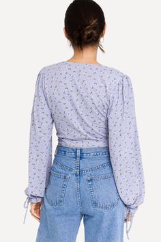 For a stunning, casual look turn to this cute cropped top featuring a lace-up closure, long puff sleeves, and a deep V neckline. Ruffled cuffs with ties add to its flattering style. -Deep V neckline.-Length, right above the waistline.-Long puff sleeves.-Ruffled cuffs.-75% Cotton 15% Nylon 10% Spandex.-By Le Lis USA. Size Guide -The model is wearing a size Small.-Model Specs. HEIGHT: 5'9" BUST: 32B WAIST: 24" HIPS: 34" Shipping ﻿-Ships within 5 days in the US. Long Puff Sleeves, V Neckline, Cropped Top, Deep V, Puff Sleeves, Casual Looks, Puff Sleeve, Size Guide, Lace Up