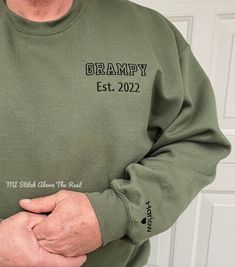 "This custom embroidered sweatshirt with kid's names on the sleeve makes a perfect Father's Day gift, birthday gift, gift for a new grandpa, Valentine's Day gift, Expecting Dad Gift, or just because! You can even change it up to have it say \"mom\", \"aunt\", \"grandma\", etc. instead. SWEATSHIRT DETAILS *Unisex size *Embroidered text/ design *50% cotton, 50% polyester. Heather Sport colors are 60% polyester, 40% cotton *Double-needle stitching *1x1 ribbed collar, cuffs and waistband with spande Customizable Long Sleeve Sweatshirt For Father's Day, Gifts For Expecting Dads, Custom Embroidered Sweatshirt, Dad Sweater, Embroidered Text, Grandpa Birthday Gifts, Grandpa Birthday, Sweatshirt Details, Embroidered Sweatshirt