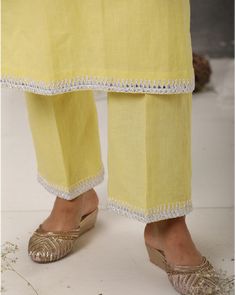 Description: Linen kurta paired with straight pants, both hemmed with ivory anchor embroidery. Enhanced with a statement neckline with anchor embroidery, it makes a truly mesmerising vision.Colour Yellow/PeachFabric LinenCare Dry Clean onlyFit Tailored Summer Chikankari Embroidery Straight Kurta Pant Set, Cotton Sets With Embroidered Neckline Straight Kurta, Summer Straight Kurta Pant Set With Resham Embroidery, Summer Pant Set With Resham Embroidery And Straight Kurta, Summer Pant Set With Resham Embroidery Straight Kurta, Festive Summer Kurta With Embroidered Hem, Summer Designer Chikankari Embroidery Pant Set, Elegant Cotton Sharara With Embroidered Border, Eid Cotton Kurta With Embroidered Neckline