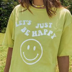 Groovy Yellow Lime Green Graphic Tee With Green With Font & A Smiley Face. Reads "Let's Just Be Happy". The Tee Has An Oversized Look. This Would Be Perfect Paired With Biker Shorts Or Could Be Styled Tied In A Knot At The Bottom. 82% Polyester, 15% Rayon & 3% Spandex Model Is Size Small Wearing Size Small Brand New! From My Boutique! Green Fun Tops For Day Out, Fun Green Tops For Day Out, Fun Green Tops With Text Print, Fun Green Top With Text Print, Fun Yellow Tops With Text Print, Spring Crew Neck Top With Smiley Face, Cute Yellow Tops With Text Print, Spring Smiley Face Crew Neck Top, Cute Yellow Text Print Top