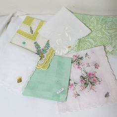 "The 8 vintage ladies handkerchief with scalloped edges from which to choose one. Estate sale hankies have not been laundered after found. No holes or spots noticed. Choose one from drop down menu. 1. cotton pink flowers scalloped edge --14\" 2. mint green open cutwork border all cotton--11\" 3. yellow border 2 stickers Dacron and cotton--14\" 4. green flowers scallop border 14\" dis colored in places.--14\" JC Penney price sticker 5. Cotton with flower corners Treasure Master sticker made in Sw Vintage Wedding Handkerchiefs For Summer, Vintage Cotton Handkerchiefs For Spring, Vintage Handkerchiefs For Spring Gift, Vintage Summer Handkerchiefs As Gift, Vintage Summer Handkerchiefs For Gift, Vintage White Handkerchiefs For Spring, White Vintage Handkerchiefs For Summer, Metal Plant Hangers, Wedding Birdcage