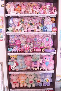 a shelf filled with lots of stuffed animals