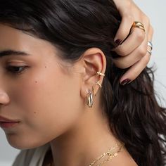 Bold adjustable Gold Ear Cuff that hugs around your upper lobe and conch. Sold as a single earring cuff. Gold Vermeil Hypoallergenic, lead and nickel free Thickness 3mm Inside Length 13mm (Does not fit those with large ear lobes) #E512-Gx1 Earring Cuff, Upper Lobe, Gold Ear Cuff, Single Earring, Cuff Earrings, Conch, Gold Vermeil, Ear Cuff, Cuff