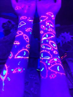 the legs are lit up with neon lights and designs on them, as if they were glowing