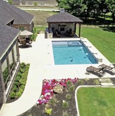 an aerial view of a pool and patio area