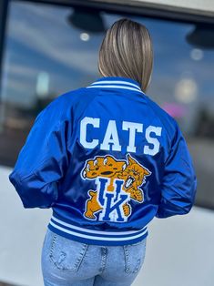 Get ready to show off your school spirit in style with our Kentucky Bomber Jacket! This cute and sporty jacket features a royal blue color and a Kentucky design, making it perfect for game days or any day. Stay warm and look amazing with this must-have addition to your wardrobe. Go Wildcats! Unisex sizing + fit Adult Small - 3XL SPECIAL CARE - WASHING INSTRUCTIONS: Hand washing and air drying are always best for these items. Wash on delicate, cold, and inside out. Always air dry to prevent lint Cheer Jackets, Royal Blue Coat, Blue Cheer, Sporty Jacket, Bag Patches, Team Jackets, Hoodies Mens, Satin Jackets, Blue Coats