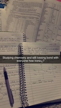 an open notebook with writing on it next to a pen and paper that says studying chemistry and all losing bond with everyone how ironic?