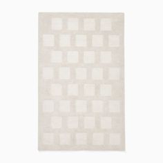 a white rug with squares on it