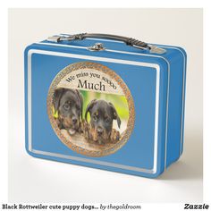 a red lunch box with two dogs on it's side and the words, we miss you so much