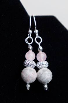 Semi-precious stone dangle earrings featuring agate and rose quartz. Beautifully simple design, elegant and eye-catching. Choose Steel ear wires or Sterling silver. Sterling Silver ear wires will appear different to those shown. They will be the same hook style, but slightly different in appearance. See the Heart Collection for an example. ERQ1S: Steel ERQ1SS: Sterling Silver ERA1S: Steel ERA1SS: Sterling Silver Elegant Nickel-free Rose Quartz Earrings, Elegant Silver Rose Quartz Earrings, Die Heart, Stone Dangle Earrings, Semi Precious Jewelry, Quartz Rose, Precious Jewelry, Rose Design, Silver Wire