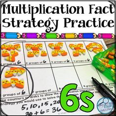 a close up of a number of oranges on a piece of paper with the words multiplication fact strategy practice