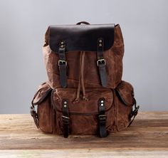 Personalized Waxed Canvas Backpack, Outdoor Rucksack, Canvas Travel Knapsack, Laptop Backpack Hiking Camping Backpack, Weekender Backpack, School office Backpack, Waterproof, Unisex, Best gift! It can be Personalized, Will be your best companion for School, office, travel, or outdoor... Features: * Backpack Size : L 13.5" x D 6" x H 18" ( L 35cm x D 15cm x H 45cm) * Made with high quality waxed canvas and full grain leather; * Waterproof retro style, simple, thick and durable; * It's a great gif Vintage Canvas Backpack With Adjustable Strap, Casual Brown Backpack For Hiking, Adventure Backpack With Adjustable Strap, Vintage Travel Backpack With Adjustable Strap, Rugged Brown Backpack For Outdoor, Rugged Outdoor Backpack, Rugged Leather Hiking Backpack, Waxed Finish Backpack For Hiking, Brown Backpack With Adjustable Strap For Outdoor Activities