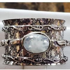 Wide Band Rule...Go Down 1 Size! This Will Fit A Size 9 Best! 3 Bands Move With The Middle Band Holding The Moonstone! Blues Pop In And Out Of This Moonstone As It Moves!!! Stunning Design! Set In 925 Stamped Sterling Silver. Please See All Pictures For Details And Measurement. Brand New. Never Worn. Wholesale Prices Always....Or Less. White Sterling Silver Jewelry With Wide Band, White Sterling Silver Wide Band Jewelry, Unique White Stackable Jewelry, Unique Stackable Silver Moonstone Ring, Unique Silver Stackable Moonstone Ring, White Oval Fusion Style Jewelry, White Oval Fusion Jewelry, Silver Wide-band Jewelry With Gemstones, Silver Wide Band Jewelry With Gemstone