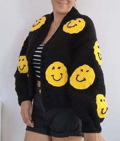 The cardigan is knitted with soft and thick yarns and is completely handmade. The cardigan is 50... 55 cm long and can be knitted to the desired length. The emoji motifs on it are fixed with 3D processing technique. The cardigan, which can be machine washed in a short program, does not fade. So why the affordable price? As HeyÇKnitting, I trust my designer cardigans and want all women in the world to wear these designs with pleasure COLOR: black. (Desired color can be knitted upon order.) MODEL: Black Acrylic Outerwear For Fall, Black Acrylic Cardigan For Winter, Winter Black Acrylic Cardigan, Black Acrylic Casual Sweater Coat, Trendy Black Acrylic Cardigan, Black Oversized Acrylic Outerwear, Black Acrylic Cardigan, Black Knitted Sweater Coat For Winter, Black Casual Acrylic Cardigan