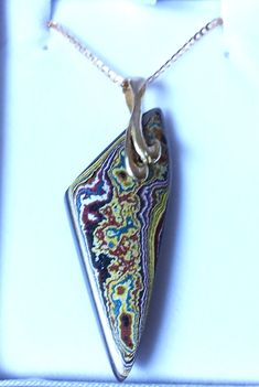 "Amazing Reversable 2 in one Fordite Detroit Agate necklace Gold filled Chain Pendant is 2.5\" long including the bail Amazing piece Both sides are beautiful so I made it reversable - 2 necklaces in one  Comes in a nice leatherette gift box" Multicolor Necklaces With Detachable Pendant, Multicolor Agate Pendant Necklace, Multicolor Necklace With Large Rectangular Pendant, Agate Necklace, I Made It, Chain Pendant, Gold Filled Chain, Chain Pendants, Necklace Gold