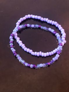 These handmade purple bracelets are just full of bright color!  Either one is sure to please any purple lover like myself!  Whether you decide on the light purple, shades of purple, or stack them both, I'm sure they will look gorgeous on you!  Very nice, bright colors. They compliment each other well.  Simple, but still adds color to any outfit! Adults and kids sizes available! Handmade Adjustable Purple Bracelets, Handmade Adjustable Purple Bracelet, Trendy Purple Friendship Bracelets As Gift, Trendy Handmade Lavender Jewelry, Casual Purple Friendship Bracelets As Gift, Handmade Trendy Lavender Jewelry, Casual Handmade Lavender Jewelry, Adjustable Purple Beaded Friendship Bracelets, Casual Purple Bracelets For Beach