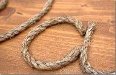 a close up of a rope on a wooden surface