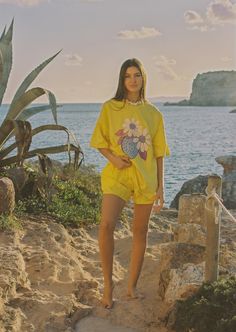 Cozy up in our sunshine-yellow tee, kissed by strawberries for a tutti-frutti twist! Oversized fit Crew neckline Short sleeves Breathable Lightweight, non-stretch fabrication 100% Cotton Made ethically in Bali Please note that slight variations and colour irregularities may occur, as the garment is hand-dyed. Refer to swatch image for an accurate design. Model wears a size small. Measurements based off size medium.Under arm to under arm: 70cmShoulder high point to hem: 70cmGrade Rule: 2.5cm diff Yellow T-shirt For Spring Vacation, Casual Yellow T-shirt For Vacation, Yellow Relaxed Fit T-shirt For Spring, Summer Relaxed Fit T-shirt For Loungewear, Relaxed Fit Summer T-shirt For Loungewear, Yellow Summer T-shirt For Loungewear, Yellow T-shirt For Summer Loungewear, Oversized Yellow T-shirt For Spring, Yellow Short Sleeve T-shirt For Loungewear