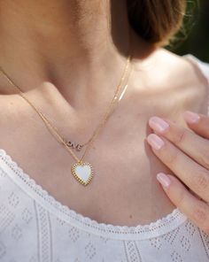 DETAILS This lovely white enamel heart necklace is guaranteed to put a smile on your face. We love it layered with other gold necklaces, or wear it solo with a cozy v-neck cardigan. 14k gold plated silver Circular clasp Charm diameter: approx. 3/4" Chain length: 16” + 2" extension Cupcakes And Cashmere, Gold Necklaces, V Neck Cardigan, Gold Plated Silver, White Enamel, Chain Lengths, Chain Length, Heart Necklace, Heart Pendant