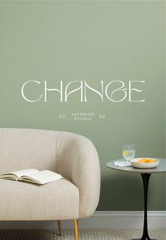 a chair and table in front of a wall with the word change written on it