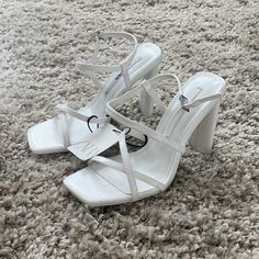 Brand New. White Sandals With 4-inch Heel For Spring, White Strappy Beach Heels, White Strappy Heels For Beach, Chic White Strappy Sandals, White Strappy Sandals With Heel Strap, White Strappy Heels With Padded Heel, White Sandals For Spring Evening, White Sandals For Evening In Spring, White Evening Sandals For Spring