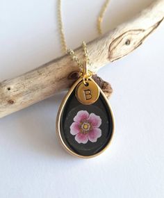 "This pretty pendant features my own hand painted Pink Japanese Anemone in watercolour set in a matte gold alloy teardrop frame and coated in crystal clear resin.  Bezel is alloy - lead and nickel free. Length 3.4cm  Width 2.5cm Choose an initial or symbol to personalise you pendant. Letters A to Z Symbols include: Heart Star Peace Flower Smiley Face If no personalised disc is required choose 'None' from the drop down menu. Choose from 14\" 16\" and 18\" gold plated chain. Maintenance To keep yo Flower Smiley Face, Flower Smiley, Peace Flower, Japanese Anemone, Daisy Pendant, Pretty Pendant, Smiley Faces, Gold Alloys, Pink Daisy