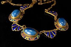 "This is a very beautiful, old and unique  ART DECO CZECH MAX NEIGER ART GLASS ENAMEL BRASS c. 1920 choker necklace. The necklace has a marvelous Art Deco shape with cabochon blue lazurite lapis, cobalt, green enamel decoration and brass. It measures 16\" long and 3/4\" wide. The necklace is in very good condition. 0.7 LT" Art Deco Choker, Antique Blue Brass Jewelry, Antique Blue Jewelry For Ceremonial Occasions, Antique Blue Medallion Necklace, Vintage Gold Jewelry With Inlay, Vintage Blue Cabochon Jewelry, Blue Art Deco Jewelry For Jewelry Making, Vintage Formal Jewelry With Inlay, Vintage Blue Ceremonial Jewelry