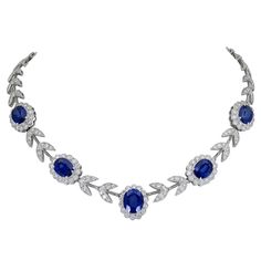 A stylish necklace showcasing five oval cut diamonds set in a flower design halo made of diamonds. Each sapphire halo is spaced by diamond leaves. Made in 18k white gold. Sapphires weigh 20.65 carats total. Diamonds weigh 8.50 carats total. 16.5 inches in length. 0.66 inches in maximum width. 1stdibs Necklace, Saphire Jewelry, 1stdibs Jewelry, Blue Diamond Necklace, Goth Wardrobe, Ruby And Diamond Necklace, Goddess Aesthetic, The Bling Ring, Sapphire And Diamond Earrings