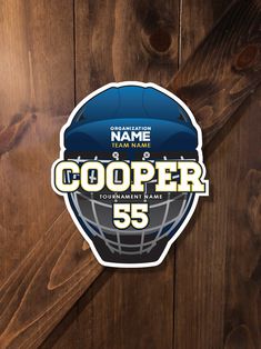 a football helmet with the number 55 on it is displayed in front of a wooden wall