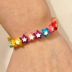 Children's Rainbow Star Bracelet Each bracelet is approximately 6 inches long. Each bracelet comes in a cute little organza tie bag. GREAT Party Bag Fillers / Gifts! Not suitable for children under the age of 3 due to small parts. Beads are 6mm in width. Materials: Plastic & resin Star Beaded Bracelet, Bracelet For Kids, Rainbow Star, Rainbow Bracelet, Party Bag Fillers, Rainbow Beads, Star Bracelet, Plastic Resin, Childrens Gifts