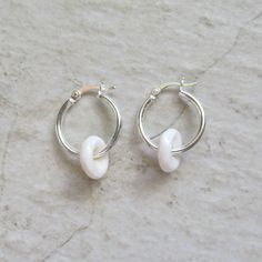 Puka Shell Hoop Earrings~ Beautiful Hawaiian puka shells adorn small tube hoops. Great gift for the beach lover! Hoops 2 X 18mm. Choose 14k gold fill, rose gold fill or sterling silver from the drop down menu. Models wearing similar designs. Shop~ http://www.etsy.com/shop/HanaMauiCreations?ref=pr_shop_more International buyers please read our shipping policies before ordering~ POLICIES~ https://www.etsy.com/shop/HanaMauiCreations/policy?ref=shopinfo_policies_leftnav Nickel-free White Huggie Earrings, Nickel-free White Huggie Earrings For Gifts, Adjustable Nickel-free White Hoop Earrings, Adjustable White Nickel Free Hoop Earrings, Nickel-free White Small Hoop Huggie Earrings, White Nickel-free Small Hoop Huggie Earrings, White Hypoallergenic Huggie Hoop Earrings, Handmade White Huggie Earrings As Gift, White Nickel-free Huggie Hoop Earrings