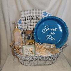 a blue plate sitting on top of a basket filled with personal care items next to a pillow