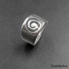 Wide Band Sterling Silver Spiral Ring, Unisex Infinity Symbol Statement Ring, Handmade Greek Jewelry, Men's Jewelry Inspired by the ancient Greek spiral infinity symbol. A meaningful statement gift that is supposed to provide good luck and long life upon the wearer. 925 Sterling silver ring bandwidth degrading from 13 to 6 mm wide Hallmarked 925 onto the inside of the ring This is more of my Greek Jewelry collection http://www.etsy.com/shop/GreekMythos?section_id=8103459 and Here you may find mo Goddess Jewelry, Spiral Ring, Art Necklaces, Greek Jewelry, Art Pendant, Infinity Symbol, Geometric Necklace, Wide Band Rings, Material Girl