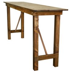 a wooden table sitting on top of a white background