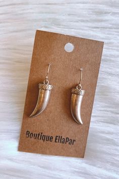 Boho inspired, horn earrings. These worn, golden, earrings are metal and feature a fish hook backing. Lightweight and small in size. Trendy Metal Cartilage Earrings With Ear Wire, Metal Fish Hook Earrings, Adjustable Gold Jewelry With Fish Hook, Trendy Brass Earrings For Pierced Ears, Trendy Pierced Brass Earrings, Trendy Single Earring For Festivals, Brass Jewelry With Fish Hook For Gift, Trendy Brass Dangle Earrings, Trendy Dangle Brass Earrings