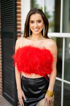 Now this is a statement top! She is sure to be your go-to top for all your events this season! Fancy features feather detailing and an elastic band with good stretch. We love her styled with our John Skort and white boots for gameday! Product Description: Fit: The Fancy Top runs true to size. Length: Cropped fit falls at natural waist. Bust: Relaxed fit accommodates all bust sizes. Waist: Cinched waist. Fabric: Fabric contains minimal stretch. Material: 55% Polyester, 45% PU, Lining-100% Polyest Feather Crop Top, Fancy Top, Feather Tops, Kimono Sweater, Fancy Tops, Swimsuit Set, Strapless Tops, White Boots, Running Tops