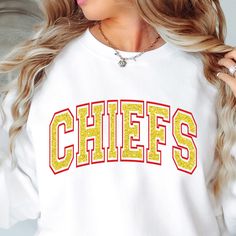 Chiefs Crew sweatshirt, off shoulder Chiefs sweatshirt, Chiefs shirt, Chiefs football, Chiefs basketball, Chiefs baseball LOGO: (red vinyl-yellow glitter) You will love this super cute, soft and comfy sweatshirt while you celebrate your favorite team! This style is a unisex style so they do run larger and are meant to be a bit baggy. ► SUPERBOWL SHIPPING CHART (please select correct shipping) Order by Tuesday, January 21st - Regular Ground Shipping to receive by Friday 31st. Order by Friday, Jan Chiefs Sweatshirt Women, Football Season Team Spirit Tops With Lettering, Collegiate Tops With Heat Transfer Vinyl For College, Yellow Tops With Letter Print For Sports Season, Team Spirit Crew Neck Top With Glitter Print, Yellow College Top For Team Spirit, Yellow Crew Neck Top For Game Day, Yellow Tops With Letter Print For Sports Events, Glitter Print Tops For Sports Events And Season