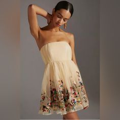 Anthropologie Women's Mini Dress Size 4 Beautiful Embroidery Color Is Beige It Is New With Tags And Has Never Been Worn Strapless Floral Embroidery Dress For Spring, Summer Wedding Mini Dress With Floral Embroidery, Spring Bohemian Embroidered Evening Dress, Spring Multicolor Embellished Embroidered Dress, Spring Evening Bohemian Embroidered Dress, Beige Intricately Embroidered Summer Dress, Beige Summer Dress With Intricate Embroidery, Summer Floral Embroidered Dress For Cocktail, Embroidered Mini Dress For Summer Evening