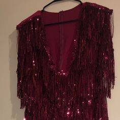 A Classy Shimmery Dress With Fringes And Mesh In The Front With A Low V Cut And Stretch Material In The Back Cheap Glamorous Sequin Dress For Party Season, Plunge Neck Long Sleeve Rhinestone Trim Fringe Bodycon Dress, Cheap Glamorous Sequin Dress For Night Out, Hot Party Dress, Hot Party Dresses, Shimmery Dress, V Cut, V Cuts, Lady In Red