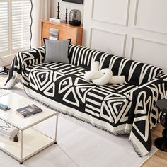 a black and white couch sitting in a living room