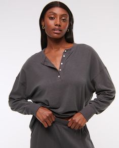 Slim-fitting long-sleeve henley top in our soft cozy lounge fabric and oversized-fit silhouette, featuring a button-up neckline and all-over textured detail. Soft-washed Sweater For Loungewear, Comfy Long Sleeve Tops With Soft Texture, Relaxed Long Sleeve Soft Knit Top, Relaxed Long Sleeve Tops With Soft Texture, Soft-washed Cozy Fit Tops For Loungewear, Oversized Cozy Tops For Loungewear, Fall Soft Texture Tops For Loungewear, Relaxed Soft Knit Loungewear Top, Relaxed Soft Knit Tops For Loungewear