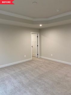 an empty living room with carpet and door open to another room that has white walls