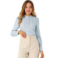 This solid-color shirt has a classic design, a staple in any office wardrobe. The delicate slightly striped texture becomes a standout detail on the classic silhouette of this white button-down, featuring a stand collar and long sleeve. This spring long-sleeved shirts feature a subtle striped texture, long sleeves with button cuffs, and a stand collar. The button-down shirt gets an elegant, office vibe update with a classic stand collar and straight silhouette. Pleats at the shoulders enhance th Elegant Solid Color Shirt For Work, Formal Button-up Solid Color Blouse, Classic Solid Color Blouse For Office Wear, Spring Button-up Ol Style Top, Elegant Solid Color Office Shirt, Light Blue Fitted Shirt For Office, Light Blue Fitted Office Shirt, Fitted Light Blue Office Shirt, Business Casual Solid Color Button-up Shirt