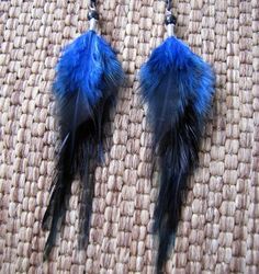 "These earrings were crafted using blue saddle feathers, black glass beads and black aluminum chain. About 8\" in length from the top of the surgical steel ear wires to the bottom of the feathers. Made to order. Please see my shop policies or shop announcement for current turn around time. If you need your order asap please let me know, I can usually accommodate rush orders. Check out the huge selection of feather jewelry and accessories in my shop! Please feel free to contact me for a custom or Peacock Feather Earrings, Long Chain Earrings, Rooster Feathers, Feather Wings, Blue Feather, Spring Photos, Feather Jewelry, Colorful Feathers, Black Chain