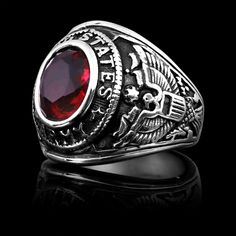 The United States Military Red Stone Army Ring from our Military Collection is custom molded and cast with a premium blend of surgical stainless steel that offers enhanced durability, even after exhaustive wear. The United States Military Red Stone Army Ring features a red stone centerpiece with the words "United States Army" and detailed eagle designs on each side. This ring is a bulkier styled ring that is great for men who want a classic everyday military ring or a veteran who wants a memorab Red Oval Engraved Ring With Polished Finish, Personalized Red Stainless Steel Jewelry, Classic Red Birthstone Ring With Polished Finish, Red Birthstone Ring With Polished Finish For Anniversary, Red Birthstone Ring For Anniversary With Polished Finish, Red Engraved Rings For Promise, Personalized Red Promise Ring, Red Polished Lab-created Ruby Jewelry, Red Lab-created Ruby Jewelry With Polished Finish