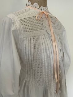 A stunning Victorian nightgown with unusual crochet panels and trims. This gown really exceeds expectations of antique nightwear . It is made in white cotton and has hand crochet inserts on the front, the shoulder and the back yoke.  Furthermore, there are hand crochet trims at the neckline, the cuffs and around the button placket. There is a satin ribbon at the neck and I can also add to each cuff if desired. Length :54 1/2" Chest : 36" Hem circumference: 73" Underarm:18" Cuff circumference abo Daywear Victorian Dress With Lace Patchwork, Unusual Crochet, White Cotton Nightgown, Crochet Panels, Victorian Nightgown, Cotton Nightgown, Women's Nightgowns, Pajama Robe, Nightgowns