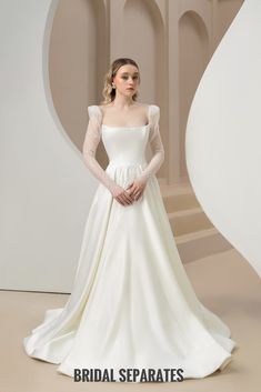 a woman in a white wedding dress with sleeves on her shoulders and the words bridal separates