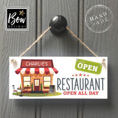 a sign hanging from the side of a wooden door that says charlie's restaurant open all day