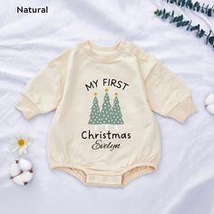 👼Pick a soft and comfortable My 1st Christmas Baby romper for your little one! 💕We offer many colors: brown, white, light mauve, green, natural and white 💕The fabric of the clothing is cotton, very skin-friendly, and excellently crafted. ✔️ Ordering Instructions 1 - Please refer to the size chart images provided in the listing for details on available sizes, styles, and colors. 2 - Choose your desired shirt color from the dropdown menu below. Winter Cotton Onesie With Letter Print, White Long Sleeve Onesie For Holiday, Long Sleeve Onesie For Birthday, Cute Cotton Onesie For Holidays, Long Sleeve Cotton Onesie For Holiday, Holiday Long Sleeve Onesie, Cotton Long Sleeve Onesie For Holiday, Long Sleeve Holiday Onesie, Cute Christmas Onesie